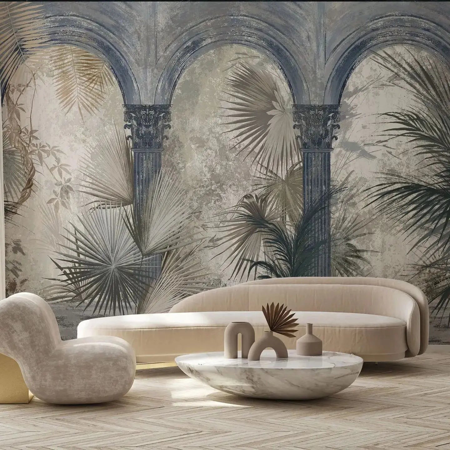 Modern living room with beige sofa, armchair, and decorative table against a tropical wall mural.