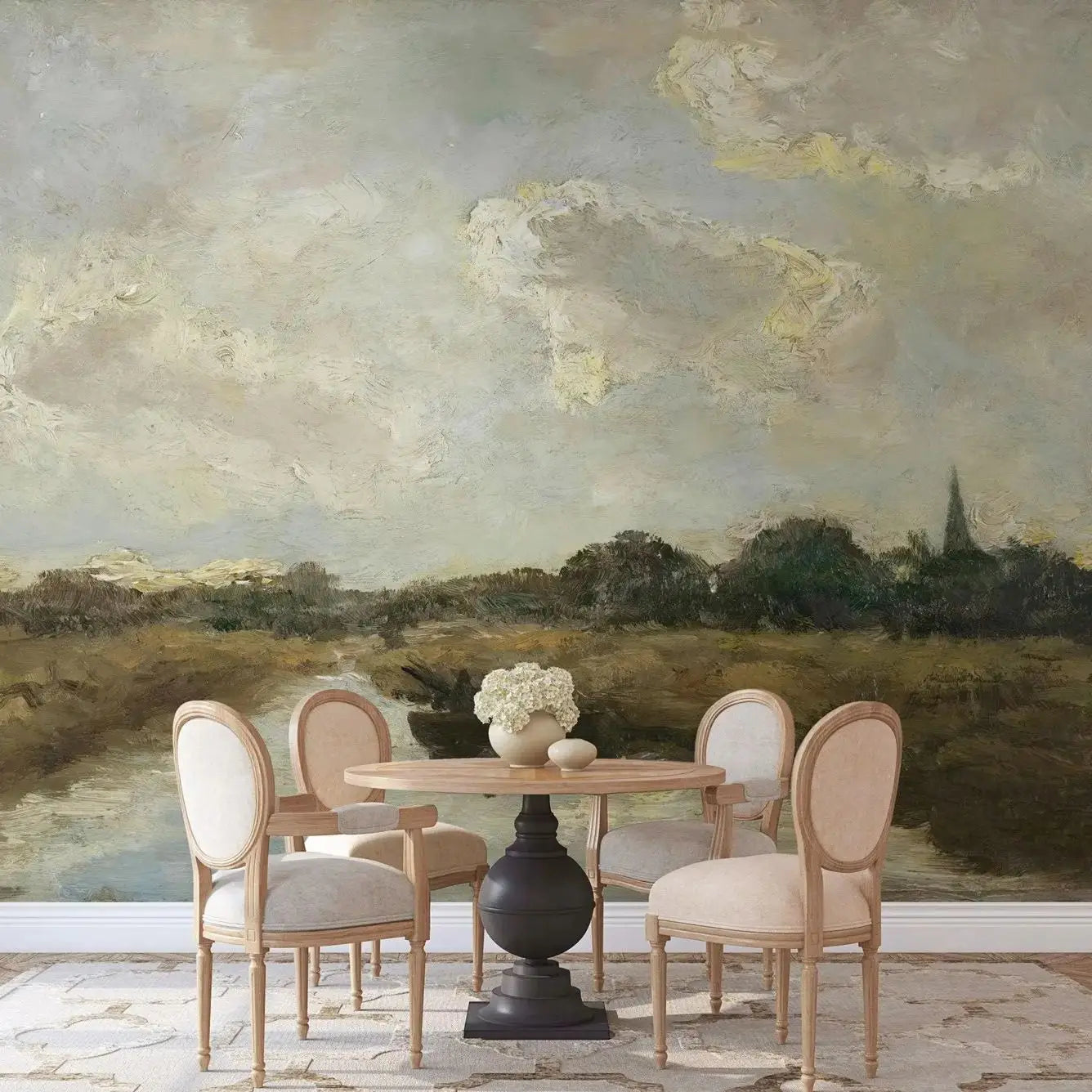 Dining area with a table and chairs against a scenic wall mural.