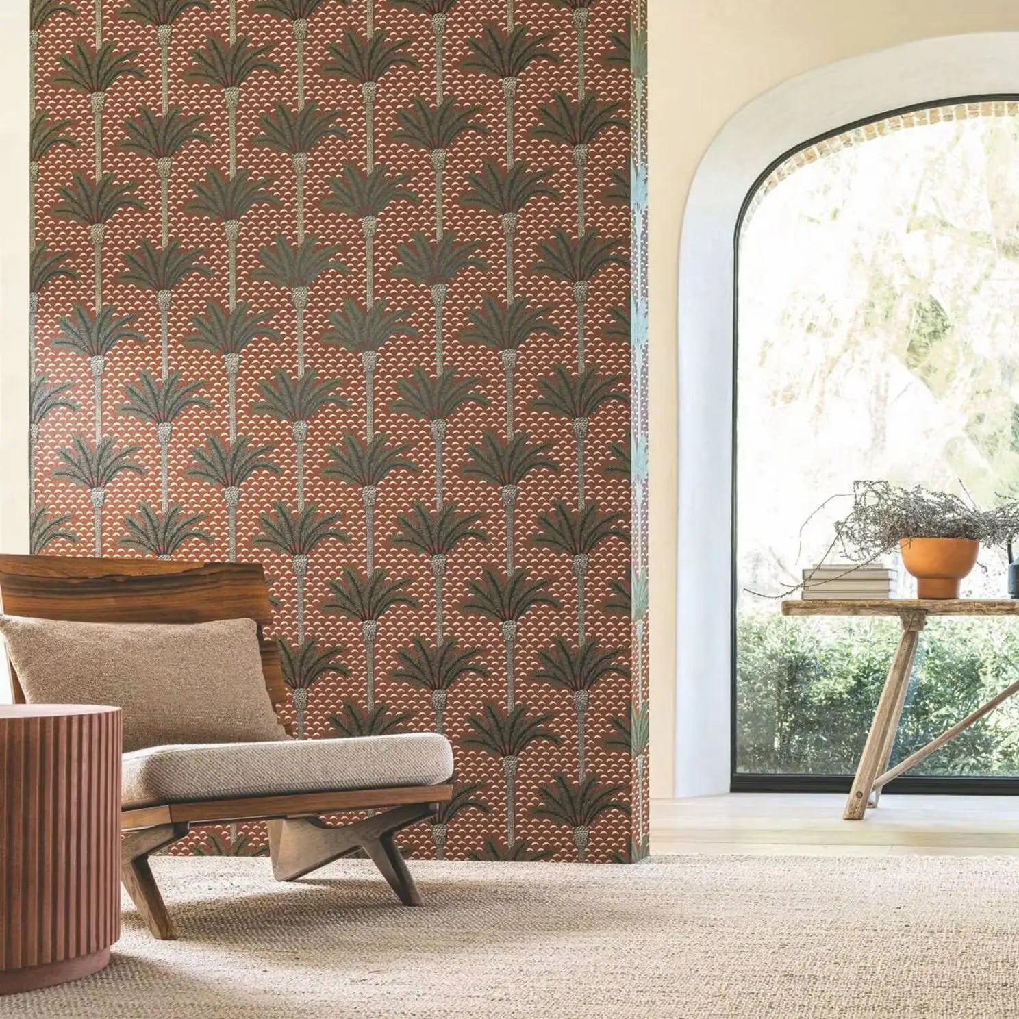 Living room with a patterned wall, chair, and table near a large window.