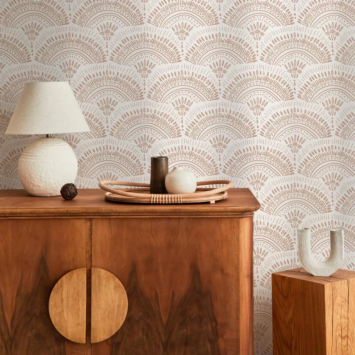 Wooden cabinet with decorative items against a patterned wallpaper