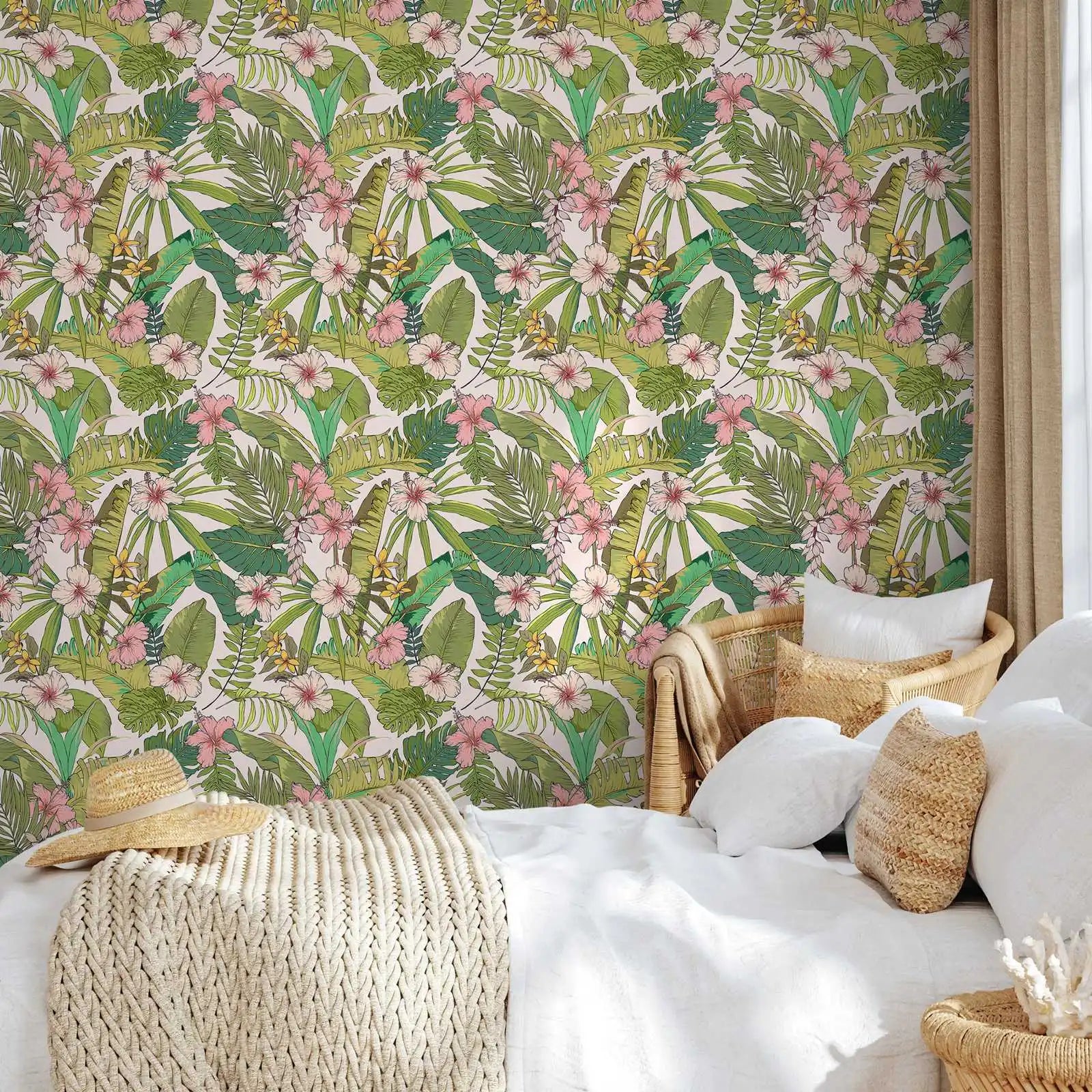 Tropical leaf and flower patterned wallpaper in a bedroom setting with a bed and wicker chair.