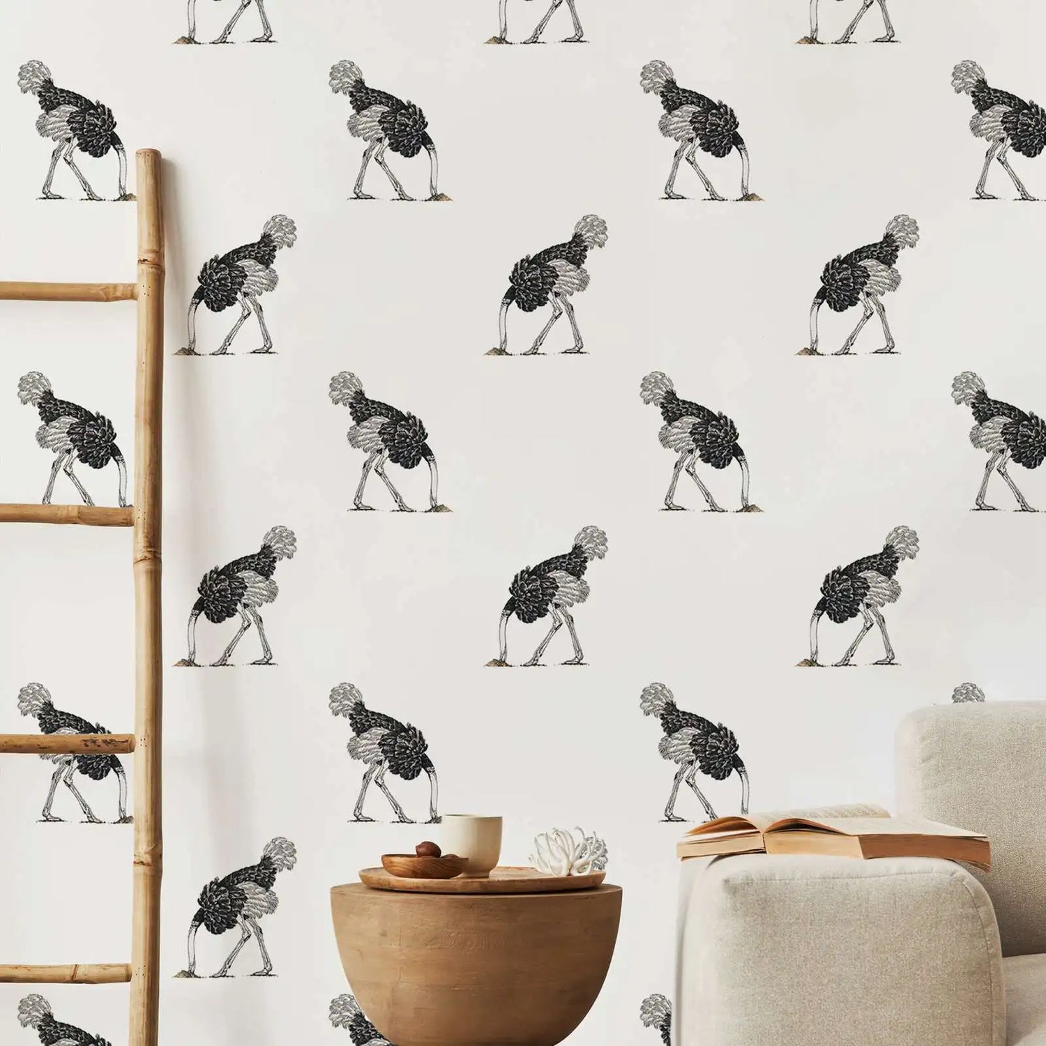 Wallpaper with a pattern of stylized birds on a white background, with a wooden ladder and furniture in the foreground.