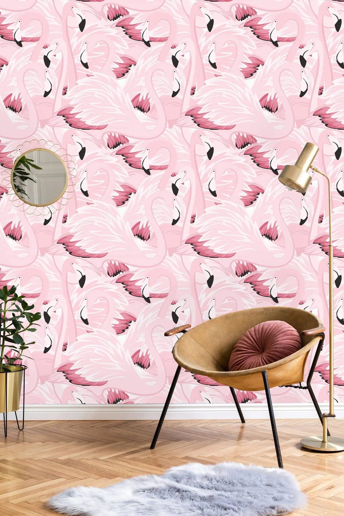 Room interior with pink flamingo wallpaper, chair, and lamp.