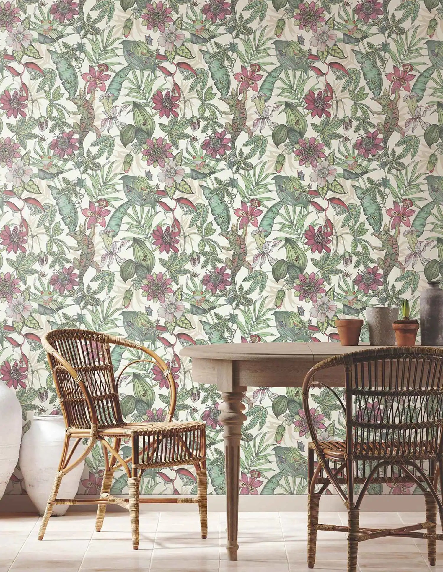 Dining area with floral wallpaper, wooden table, and wicker chairs.
