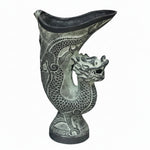 Decorative vase with dragon design on a gray background