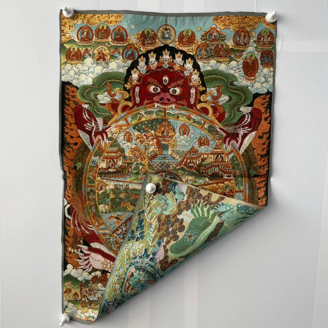 Decorative wall hanging with intricate designs on a white background
