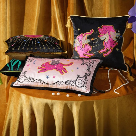 Elevate your decor with this charming accent pillow featuring an embroidered pink cat design on luxurious velvet fabric. The playful fringe adds a touch of whimsy and texture, making it a delightful addition to any sofa or bed.