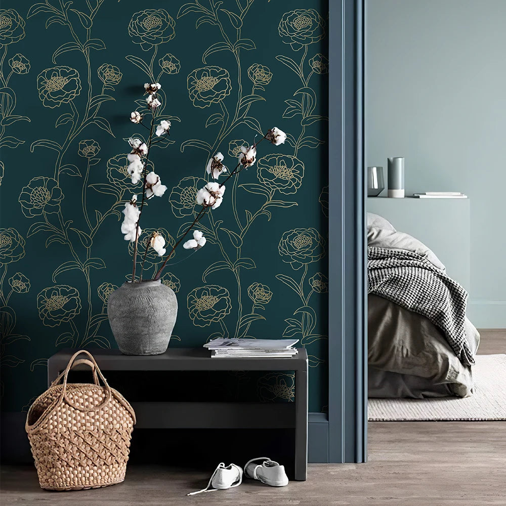 Room interior with floral wallpaper, vase with cotton branches, and wicker basket.