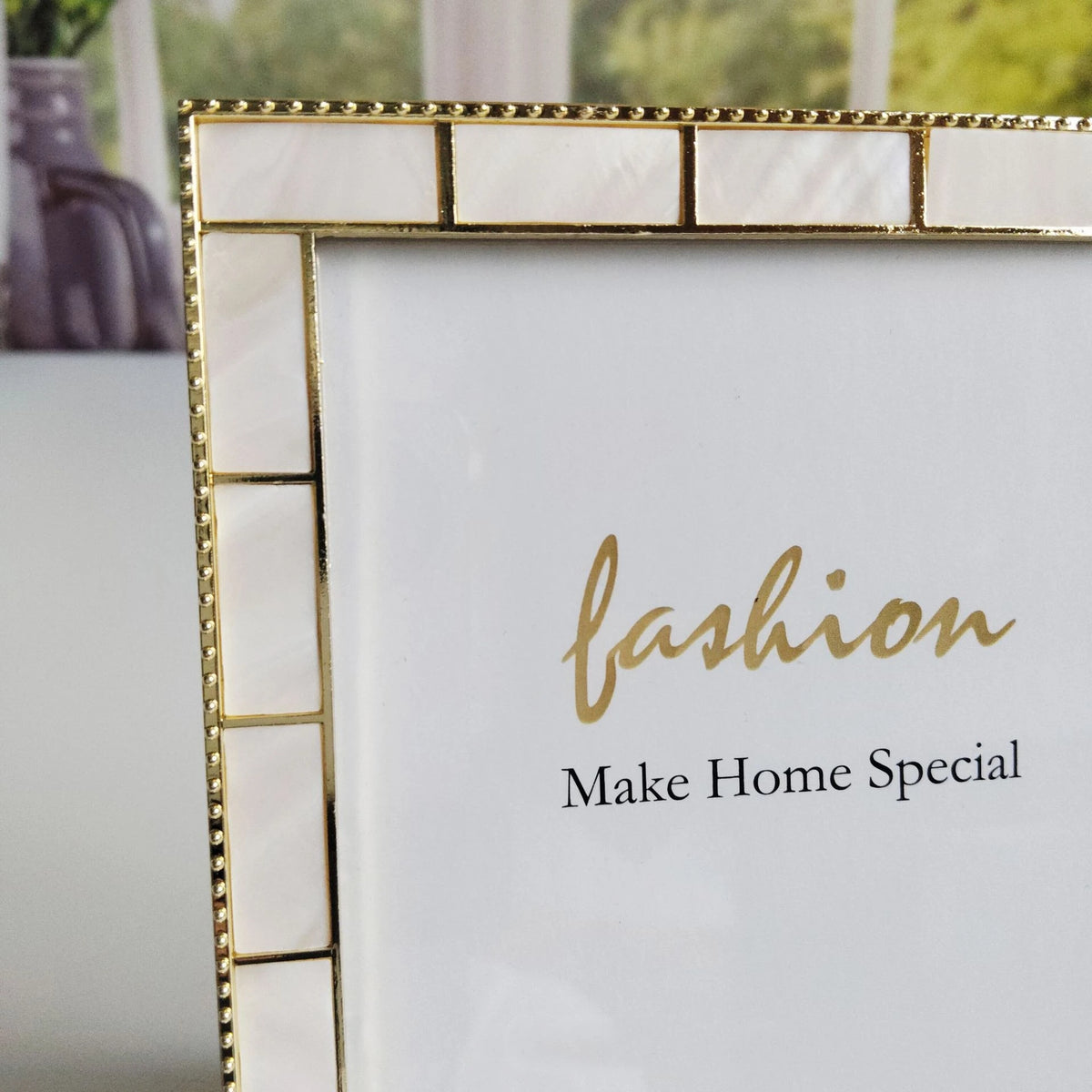 Decorative gold frame with 'fashion Make Home Special' text on a white background
