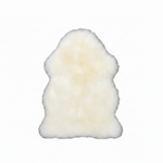 White sheepskin rug on a white background