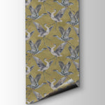 Patterned paper with bird design on a gold background