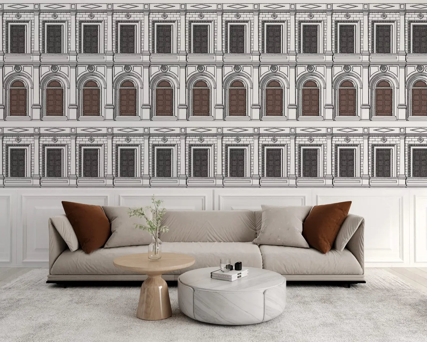 Modern living room with a sectional sofa, coffee table, and decorative pillows against a wall with architectural wallpaper.