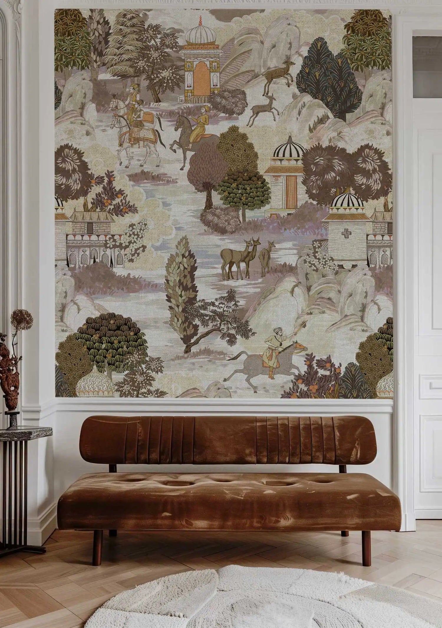 Decorative wall mural with nature and architectural elements above a brown leather bench.