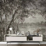 Modern living room with a large wall mural of a forest scene.