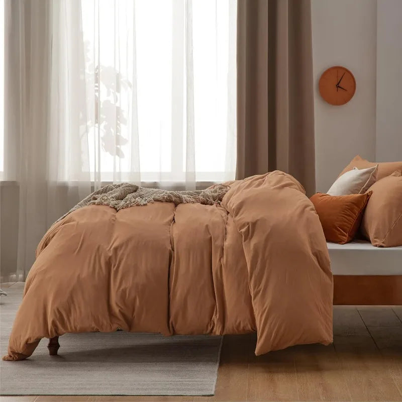 The Washed Cotton Duvet Cover Set in caramel offers a blend of comfort and style, perfect for enhancing your bedroom decor. Crafted from 100% prewashed cotton, this duvet cover set provides a naturally relaxed look and a soft, smooth feel