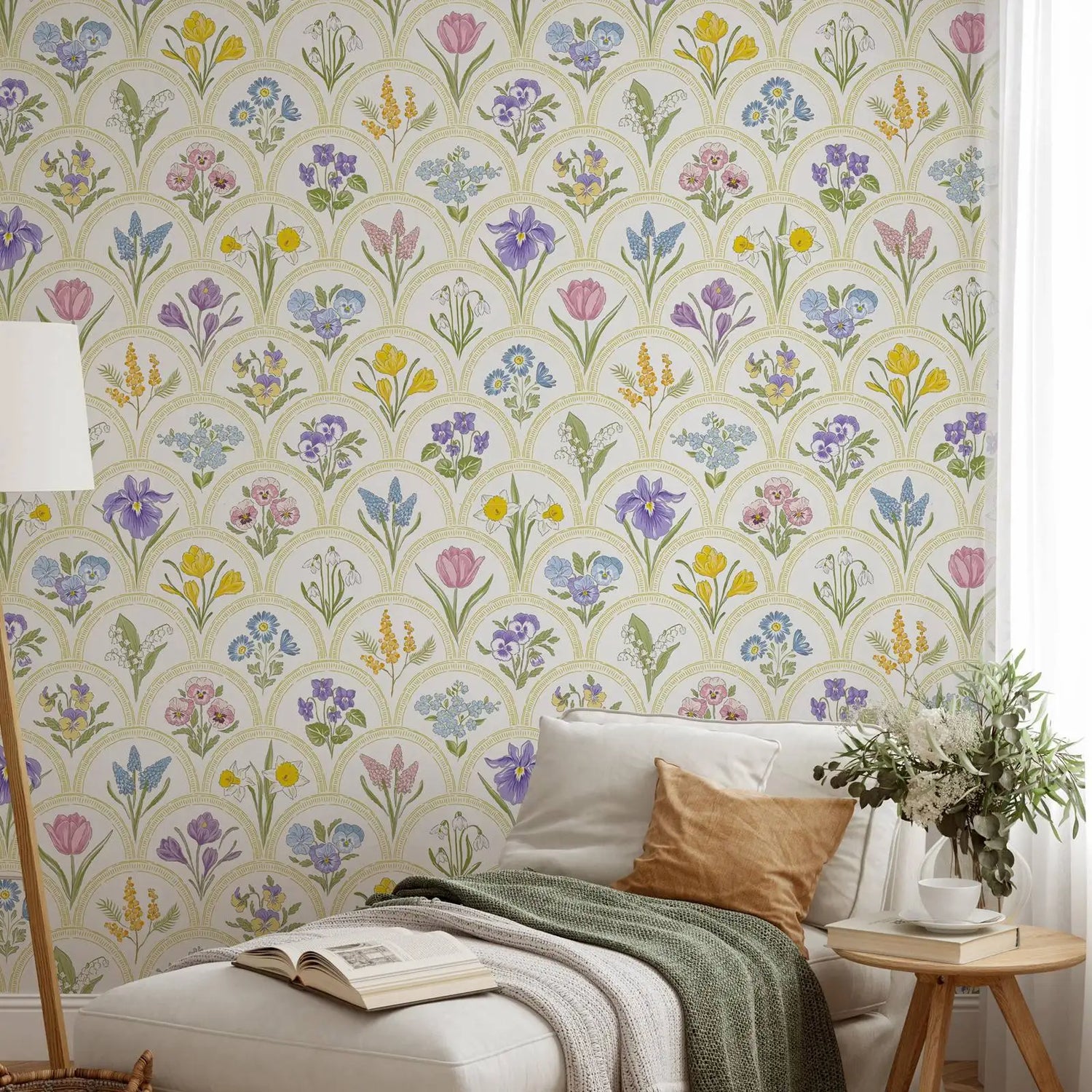 Living room with floral wallpaper, sofa, and decorative elements.