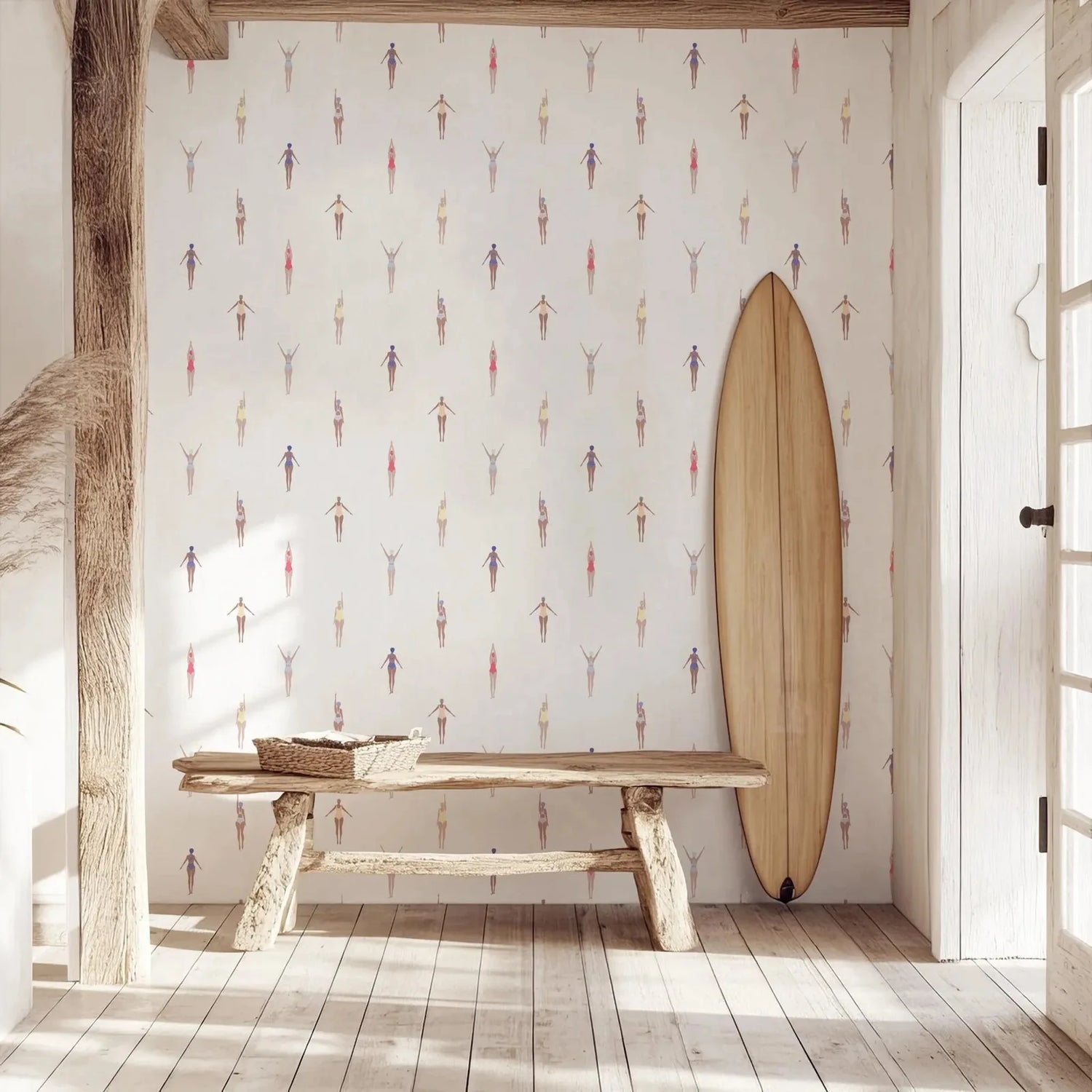 Wooden surfboard leaning against a wall with decorative wallpaper in a room with wooden floor and beams.