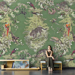 Woman sitting on a bench in front of a wall with a jungle-themed wallpaper featuring animals and plants.