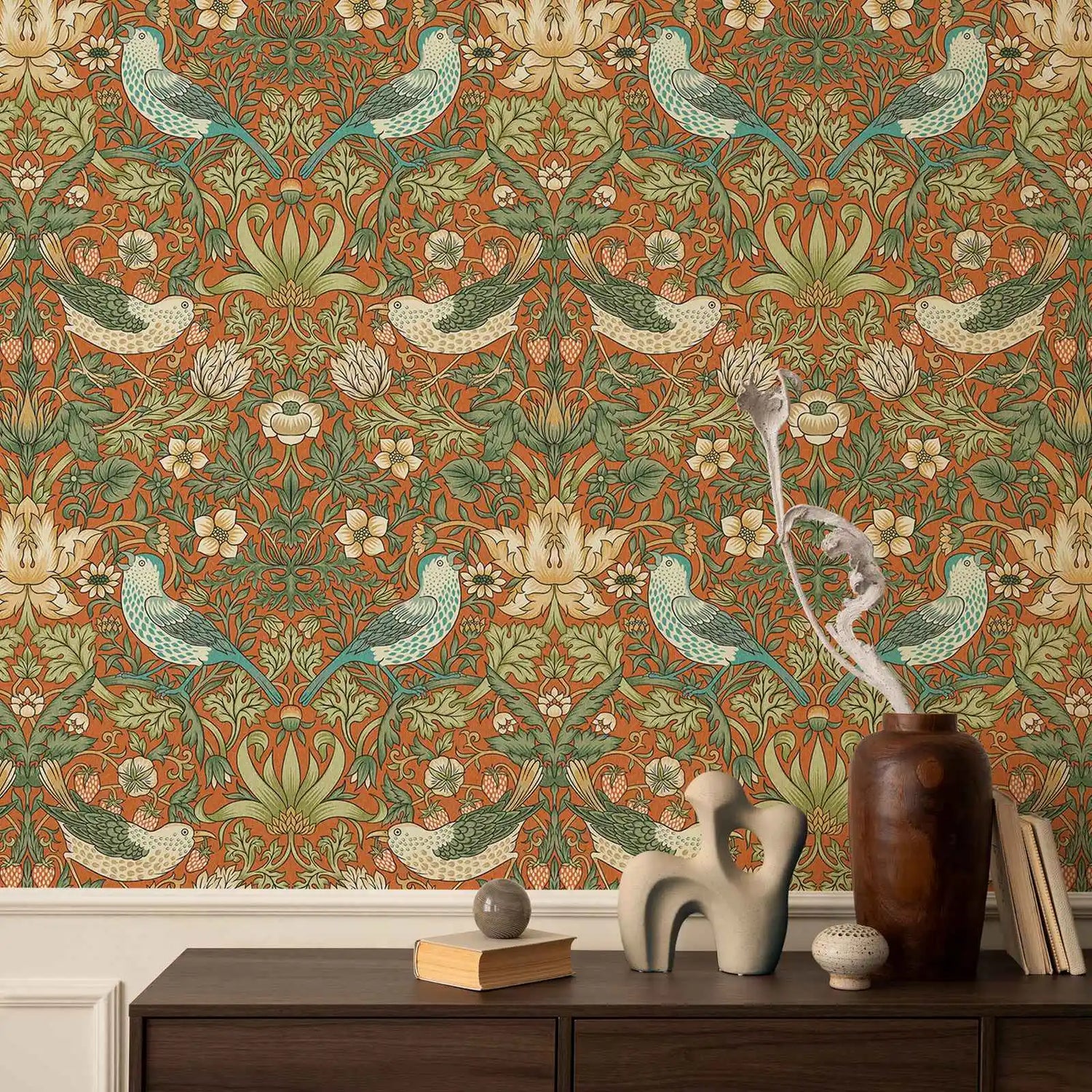 Decorative wallpaper with birds and floral patterns, featuring a wooden dresser with decorative items below.