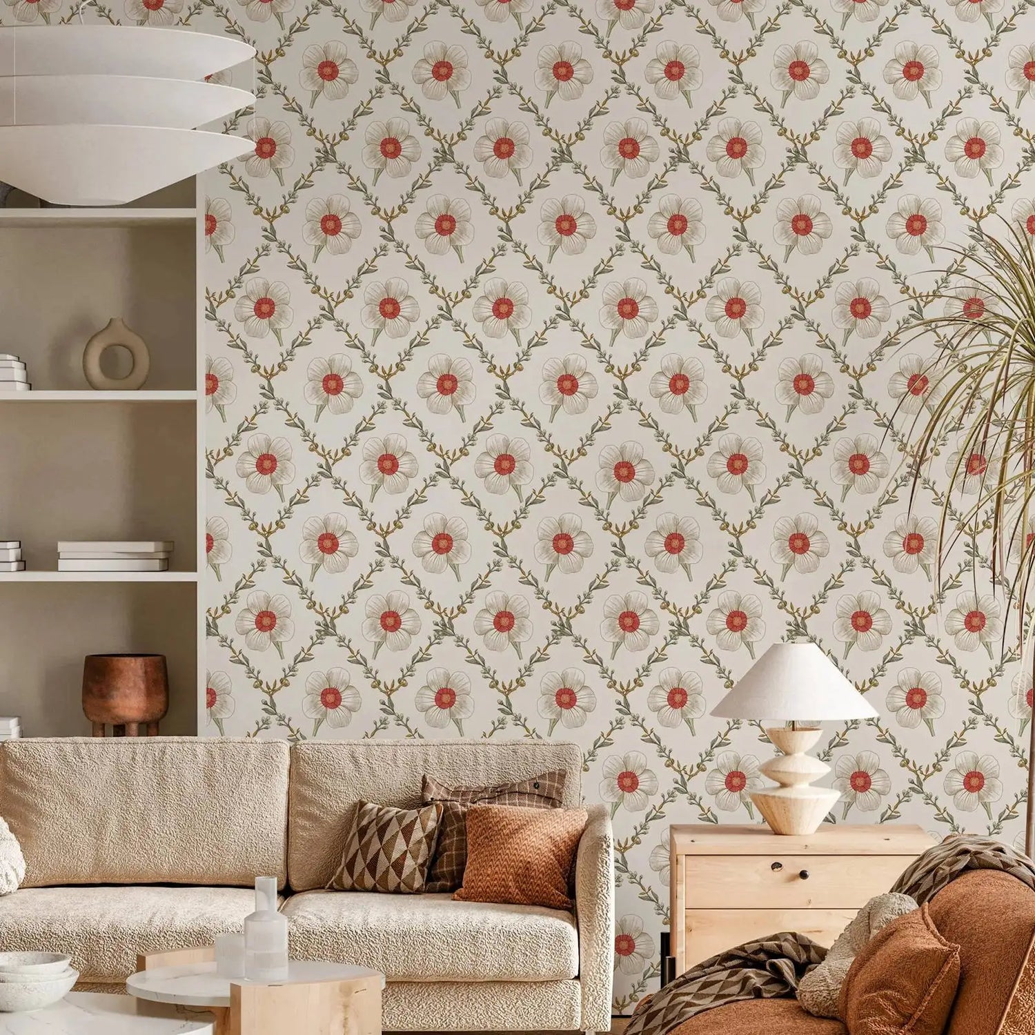 Living room with floral wallpaper, beige sofa, and wooden side table.