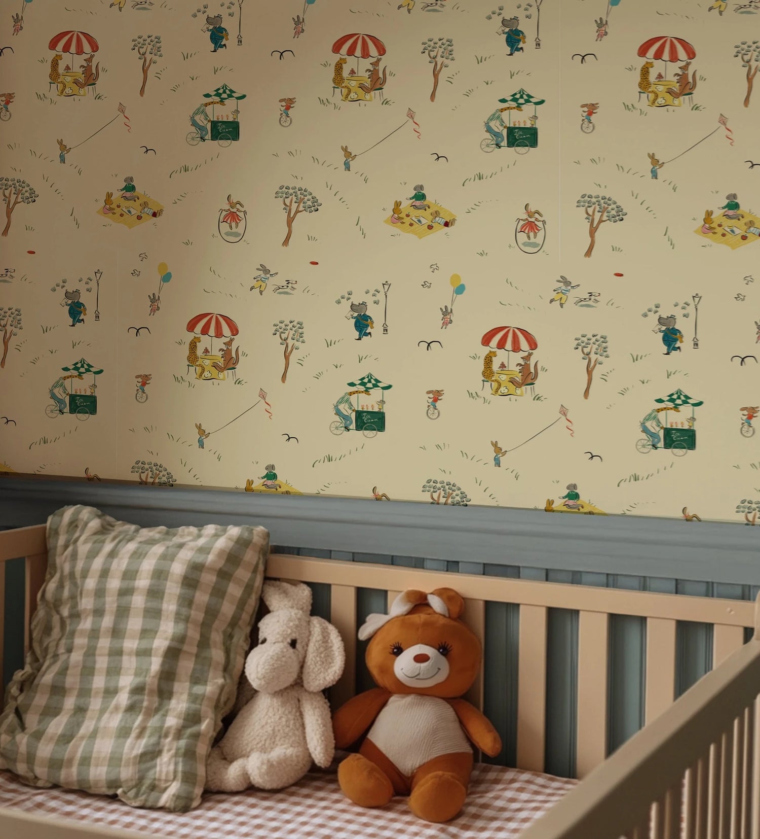 Children's room with crib, teddy bear, and patterned wallpaper