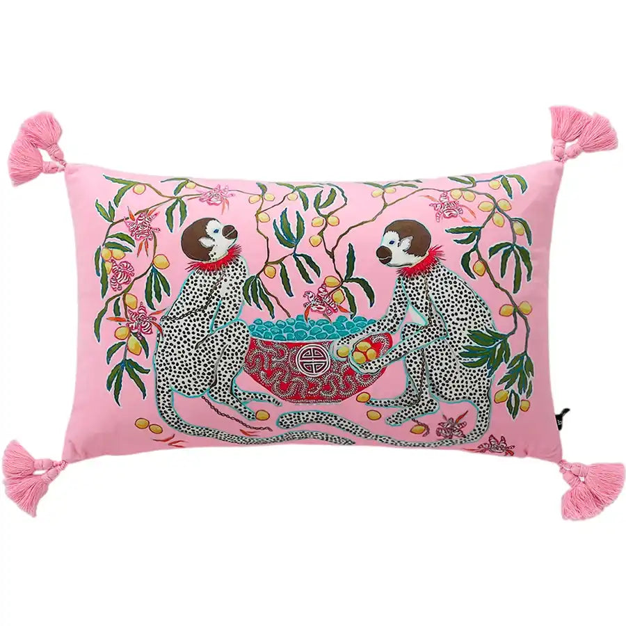 Decorative throw pillow featuring playful monkeys surrounded by floral designs on a pink background, perfect for adding a whimsical touch to your home decor.