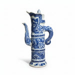 Blue and white ceramic vase with dragon design on a black background