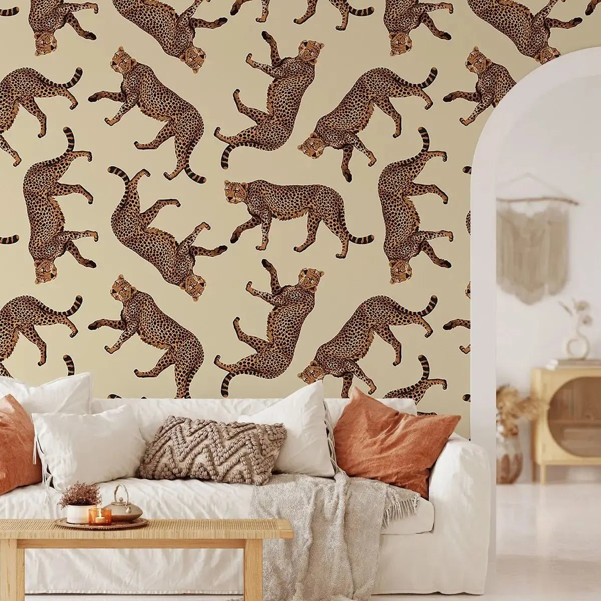 Living room with leopard pattern wallpaper and a white sofa.