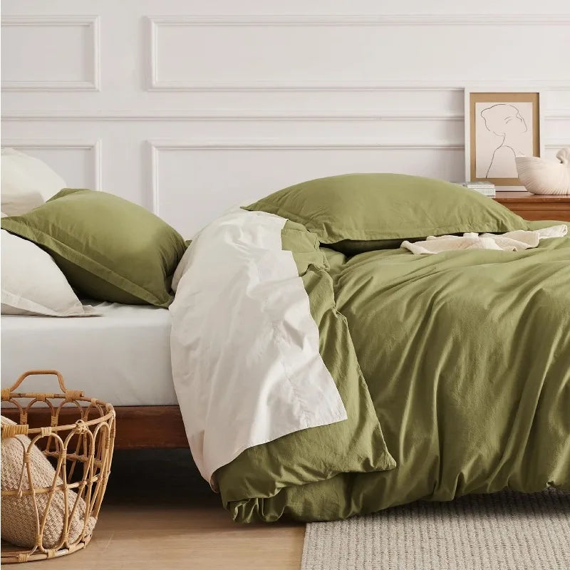 Washed Cotton Duvet Cover Set in Stone offers a blend of comfort and style, featuring a soft, relaxed texture achieved through stone-washing techniques. This process enhances the fabric's softness and imparts a lived-in look, making it a cozy addition to any bedroom.