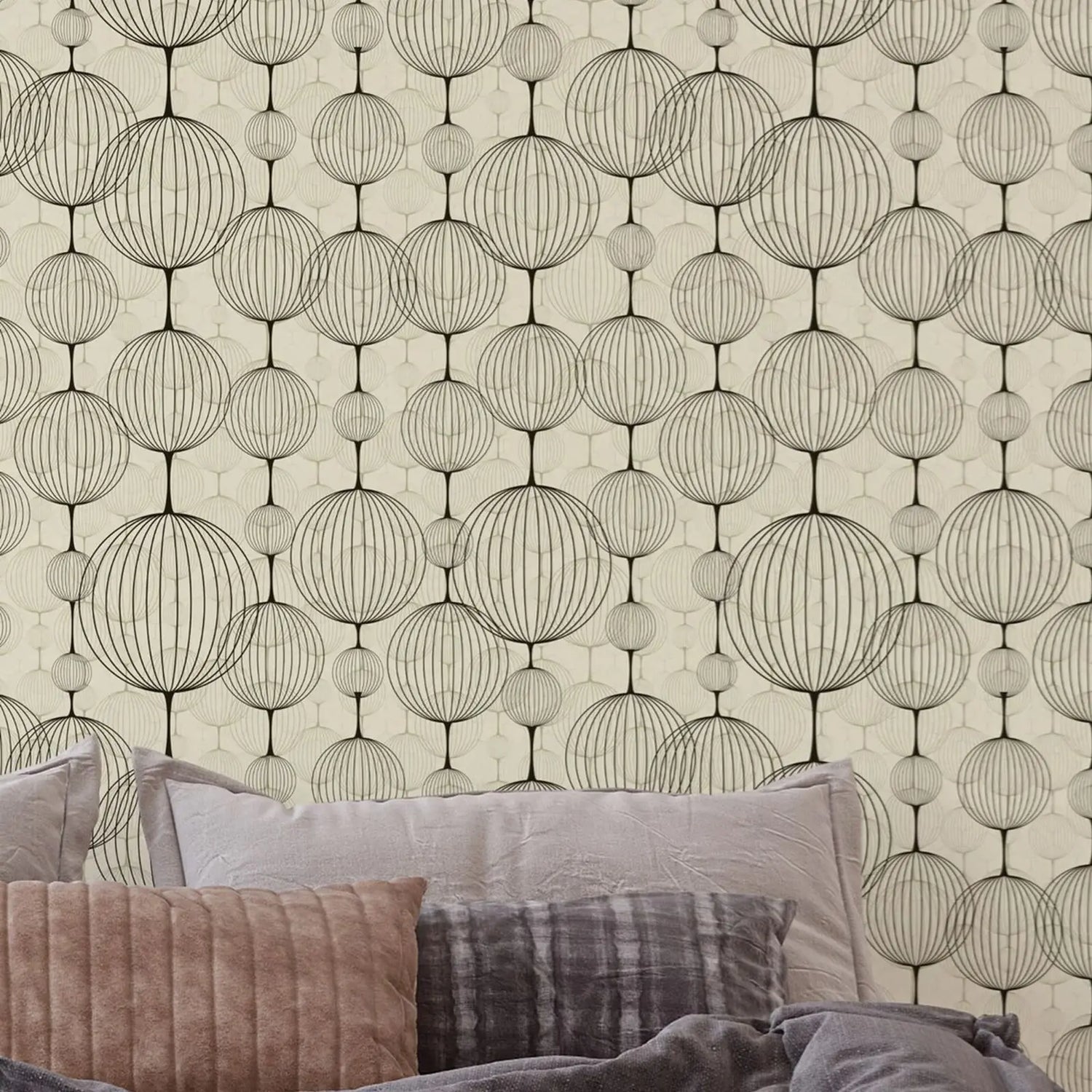Wallpaper with geometric pattern and pillows on a sofa