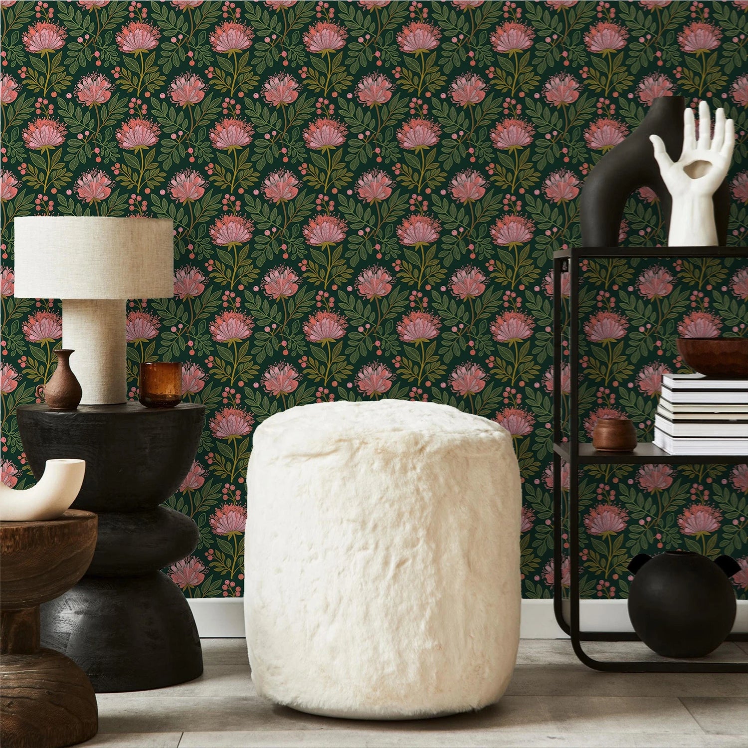 Decorative room interior with floral wallpaper, white ottoman, and various decor items.