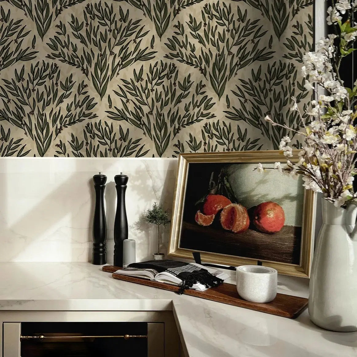 Decorative interior setting with a framed artwork, vase with flowers, and salt and pepper shakers.