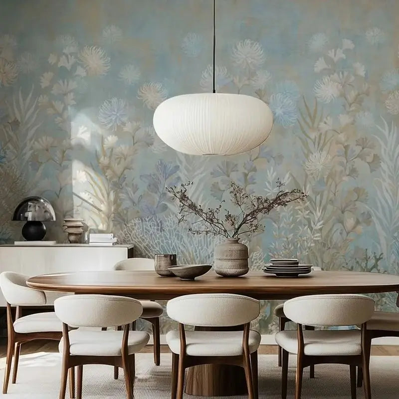 Dining room with wooden table, chairs, and floral wallpaper.