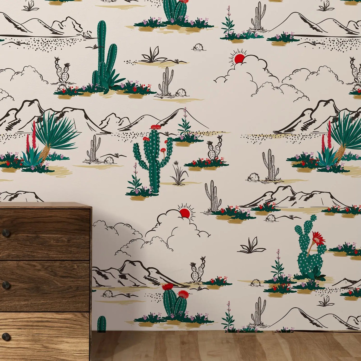 Desert-themed wallpaper with cacti and mountains on a beige background, displayed on a wall.