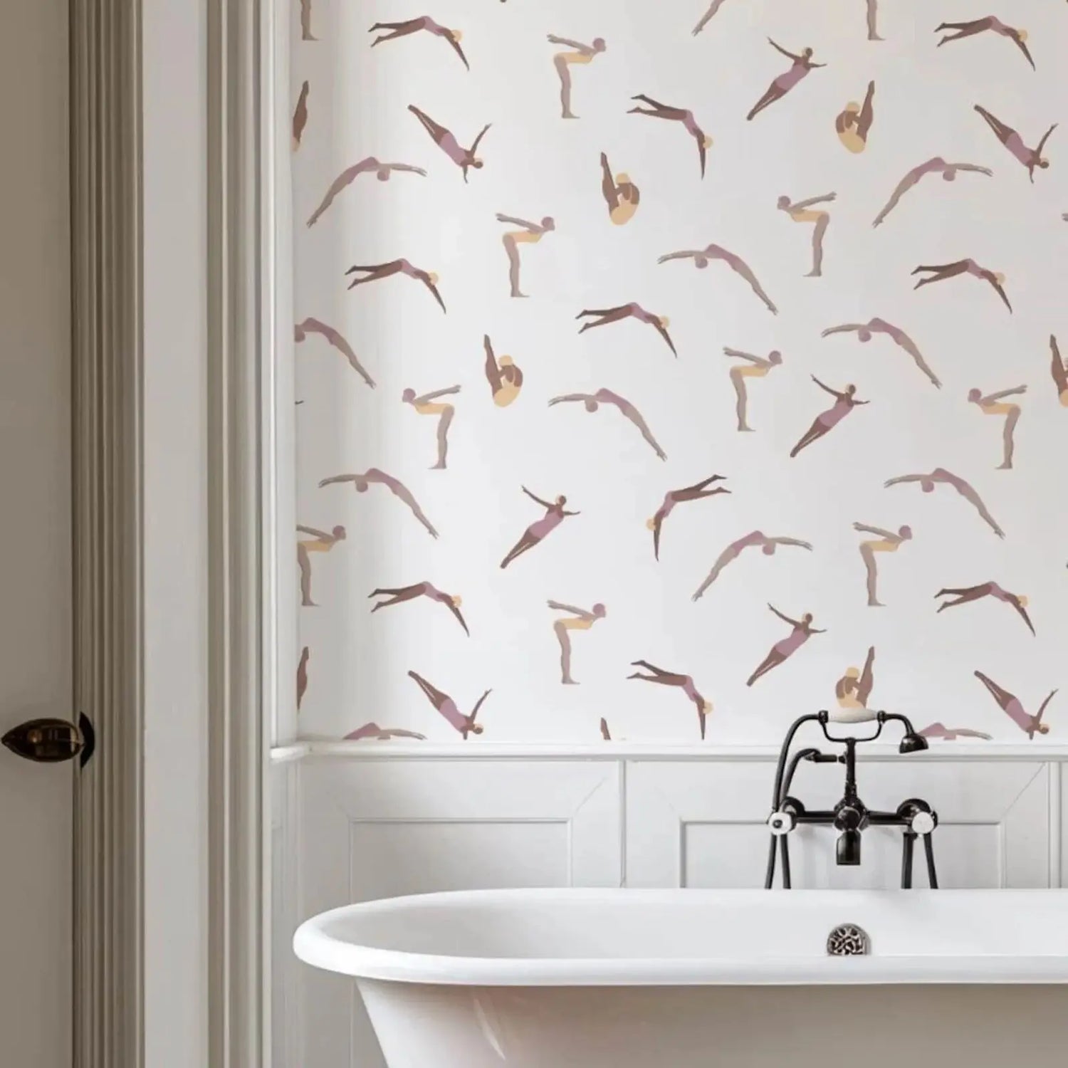 Bathroom with a white bathtub and decorative wall paper featuring women in various poses.