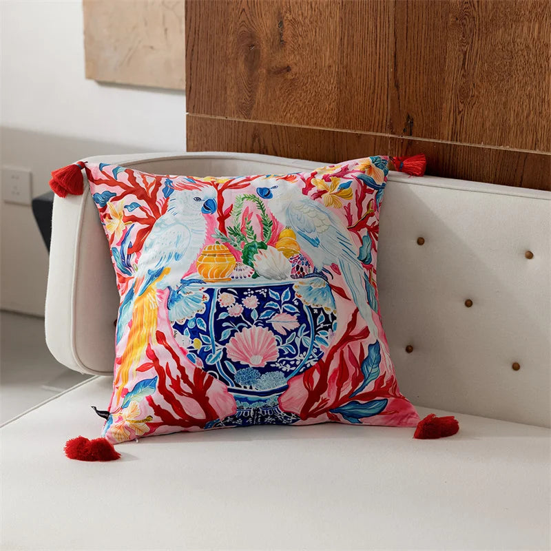 Colorful decorative pillow with parrot design on a white sofa