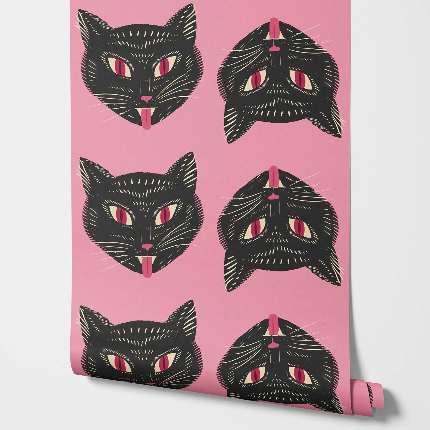 Roll of wallpaper with black cat illustrations on a pink background