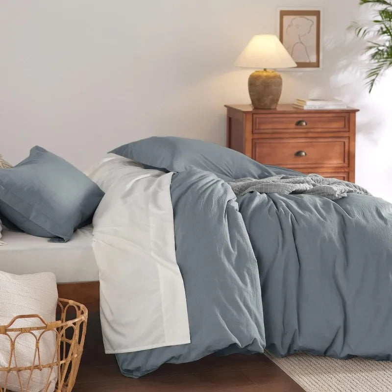 The Washed Cotton Duvet Cover Set in Gravish blueoffers a blend of comfort and style, perfect for enhancing your bedroom decor. Crafted from 100% prewashed cotton, this duvet cover set provides a naturally relaxed look and a soft, smooth feel