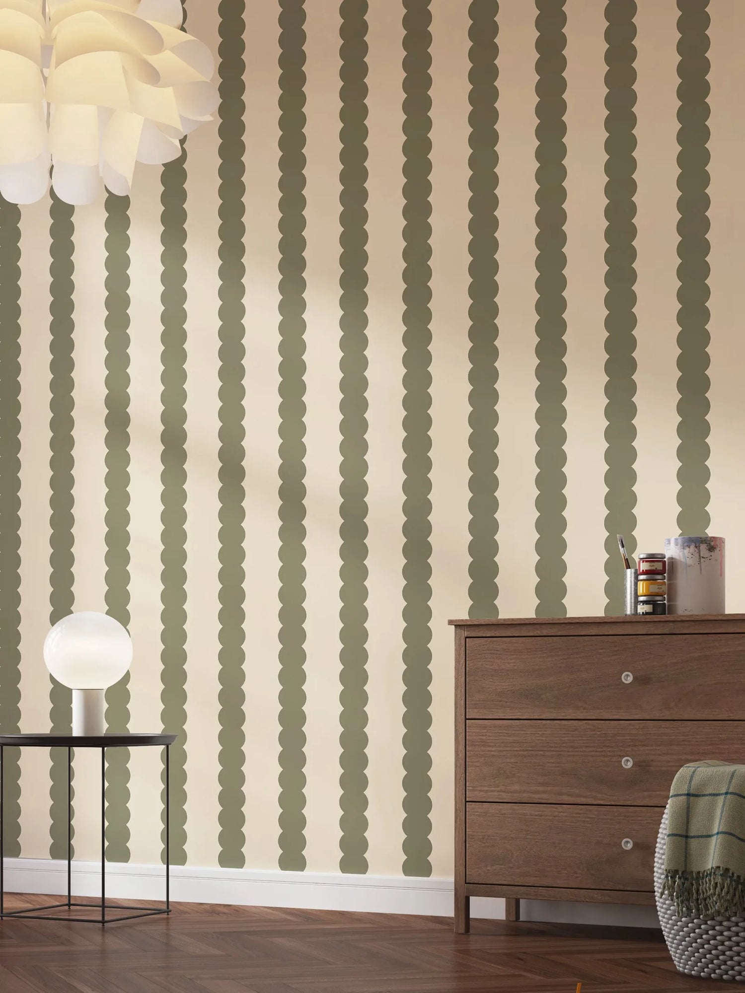 Room interior with patterned wallpaper, wooden dresser, and decorative items.