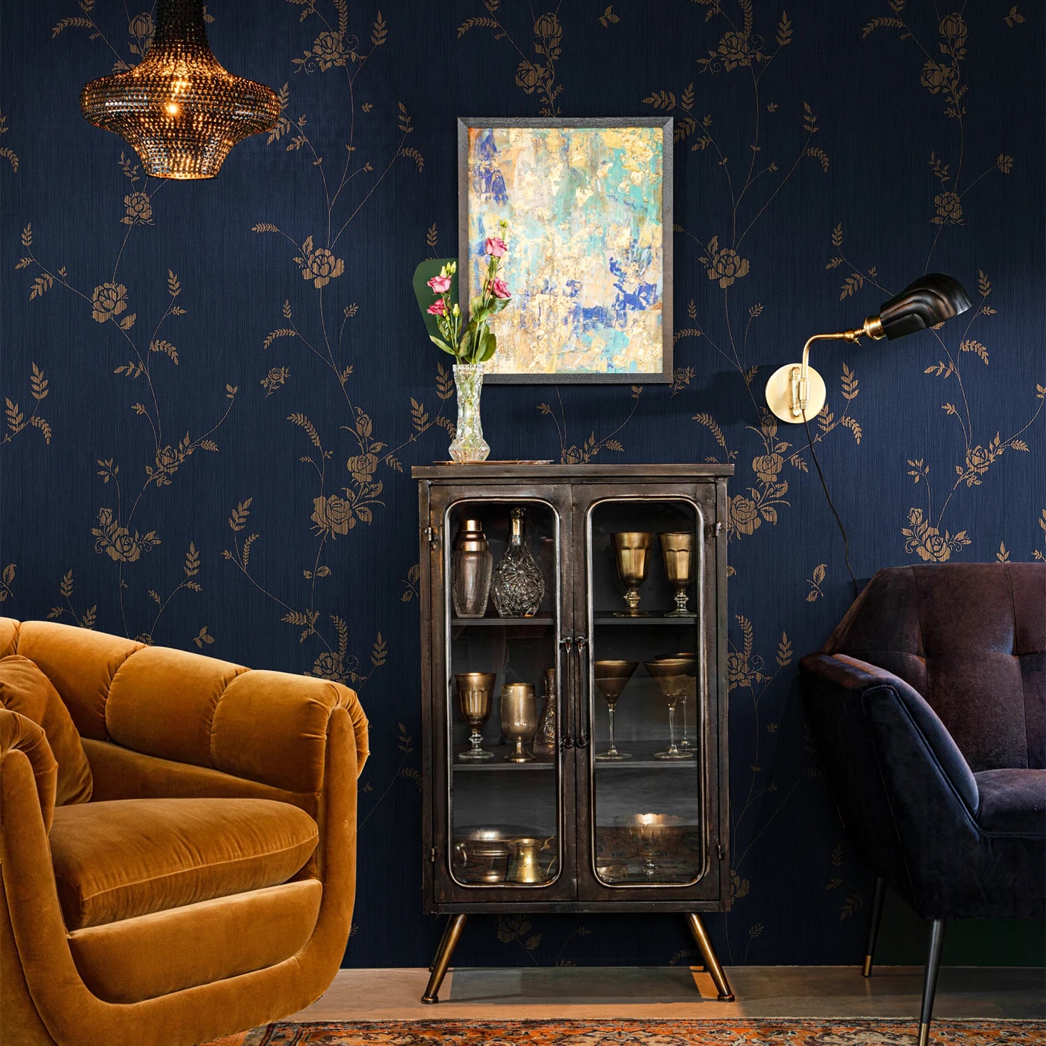 Living room with dark blue floral wallpaper, orange sofa, and decorative cabinet.
