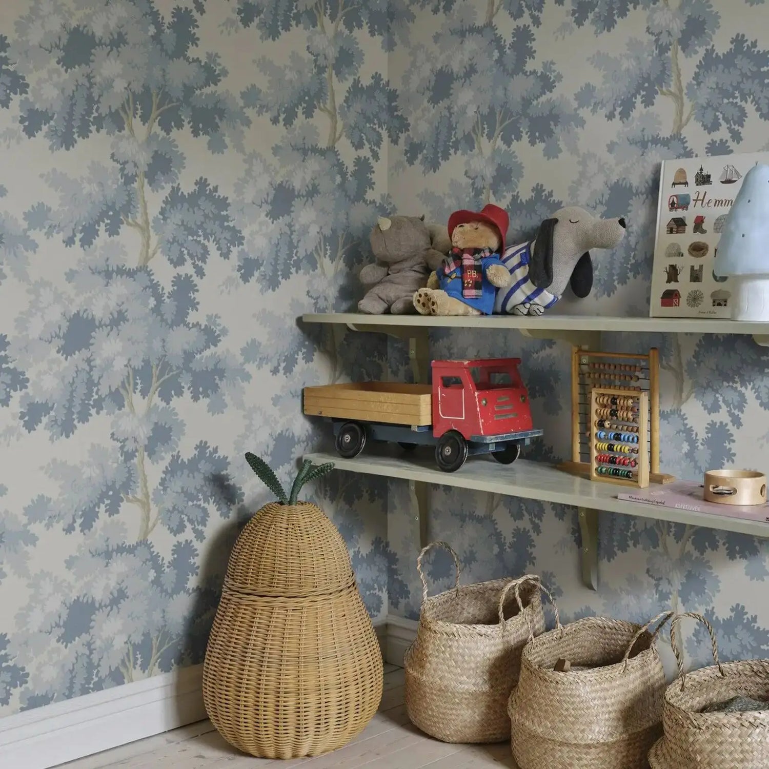 Children's room with floral wallpaper, shelves with toys, and wicker baskets.