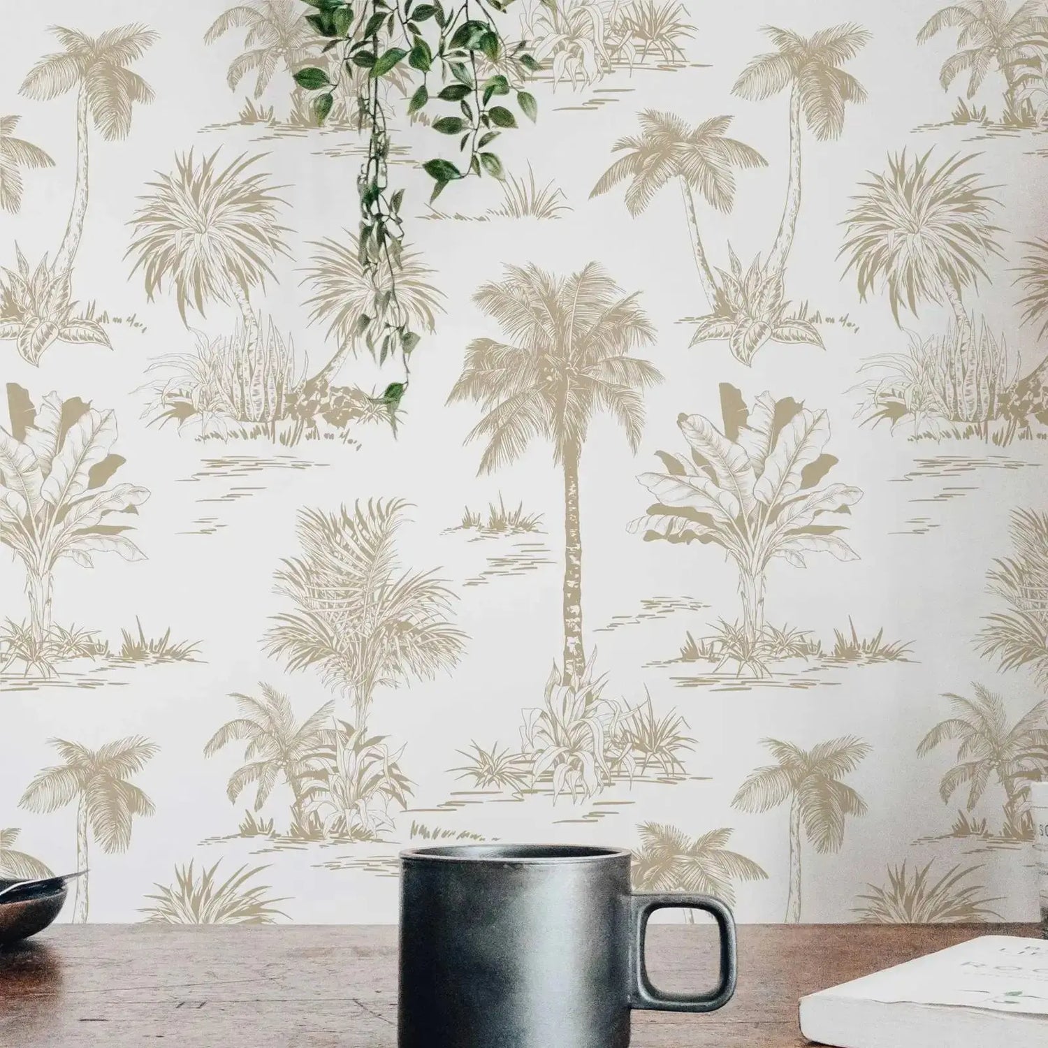 Black mug on a wooden surface with palm tree wallpaper in the background