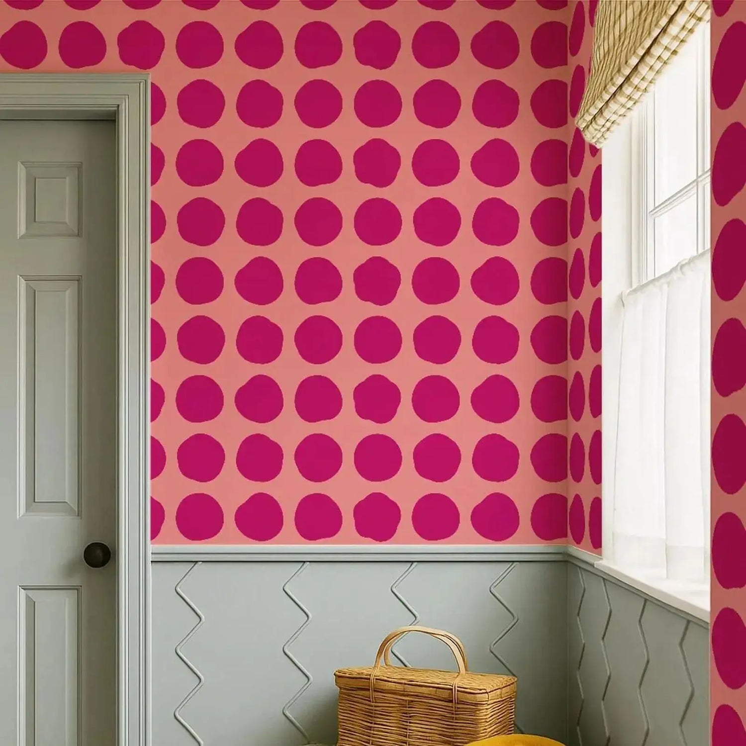 Room interior with pink wall featuring a polka dot pattern, green door, and wicker basket.