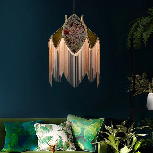  Illuminate your space with a touch of bohemian flair using this vibrant orange lampshade adorned with wild flower motifs and playful tassels. Crafted from luxurious velvet, it adds warmth and texture to any room while infusing it with a lively burst of color.