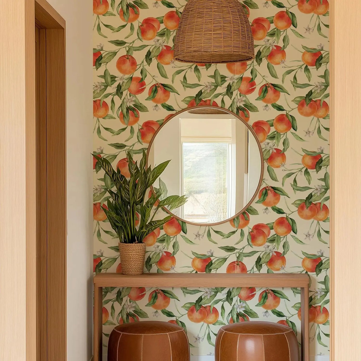 Room interior with peach-themed wallpaper, round mirror, and brown stools.