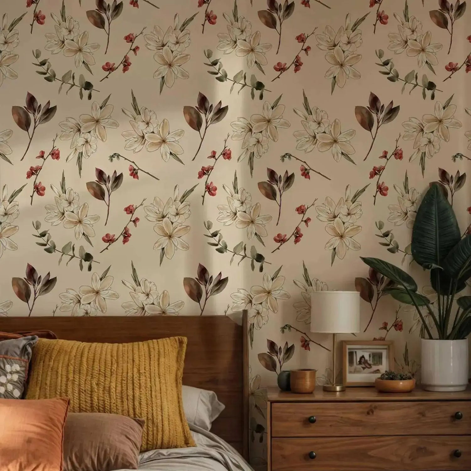 Bedroom with floral wallpaper, wooden headboard, and nightstand with lamp and plant.