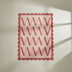 Decorative rug with scalloped edge and letter 'V' pattern on a light background