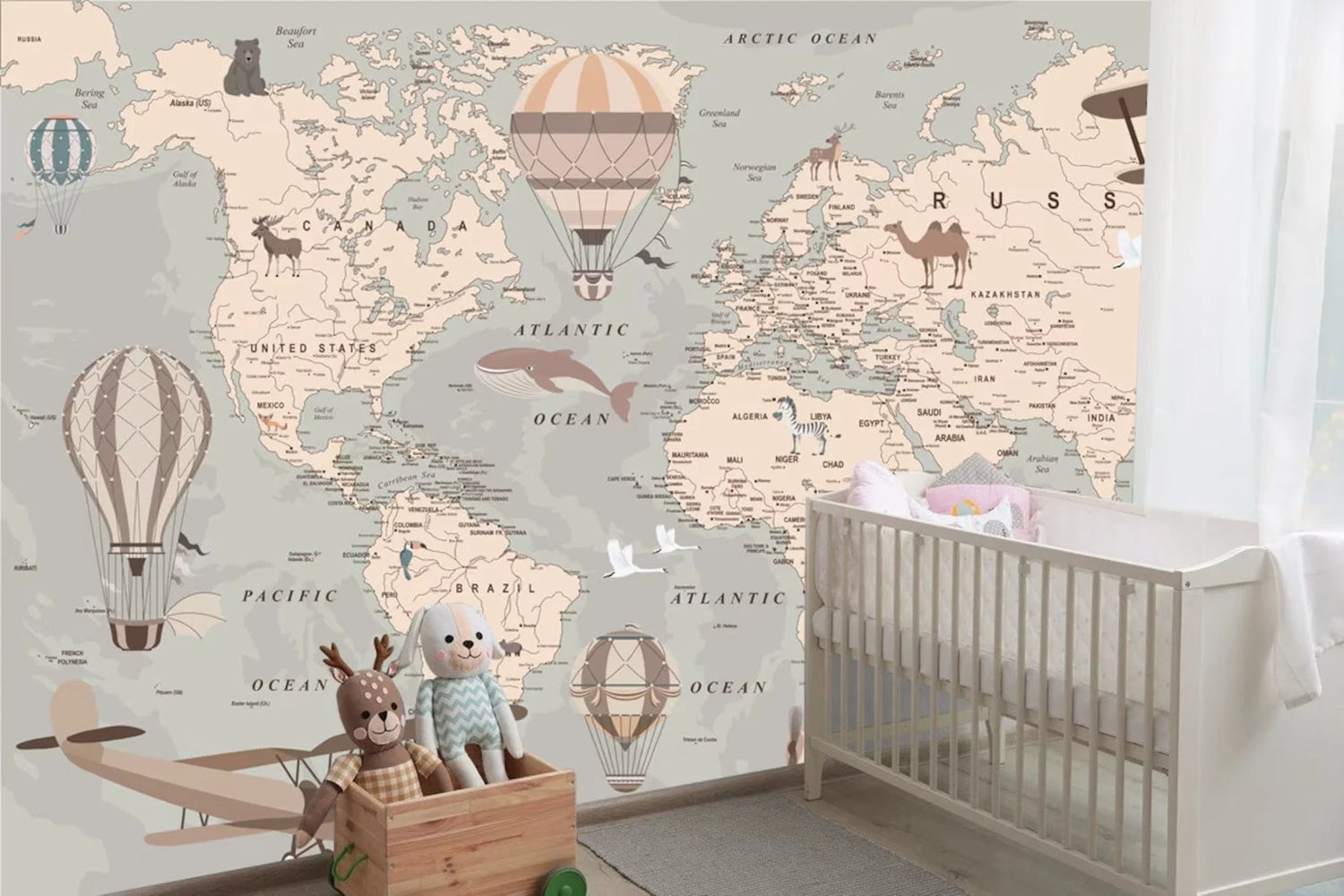 World map wallpaper in a nursery with a crib and toys.