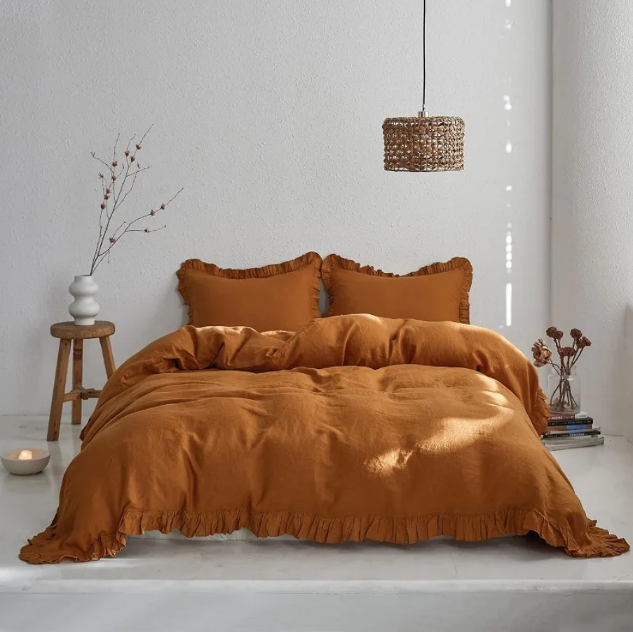 The Washed Cotton 3-Piece Duvet Set in rust offers a harmonious blend of comfort and style, perfect for enhancing your bedroom decor. Crafted from 100% washed cotton, this duvet set provides a soft, breathable feel that rivals the luxurious touch of linen.