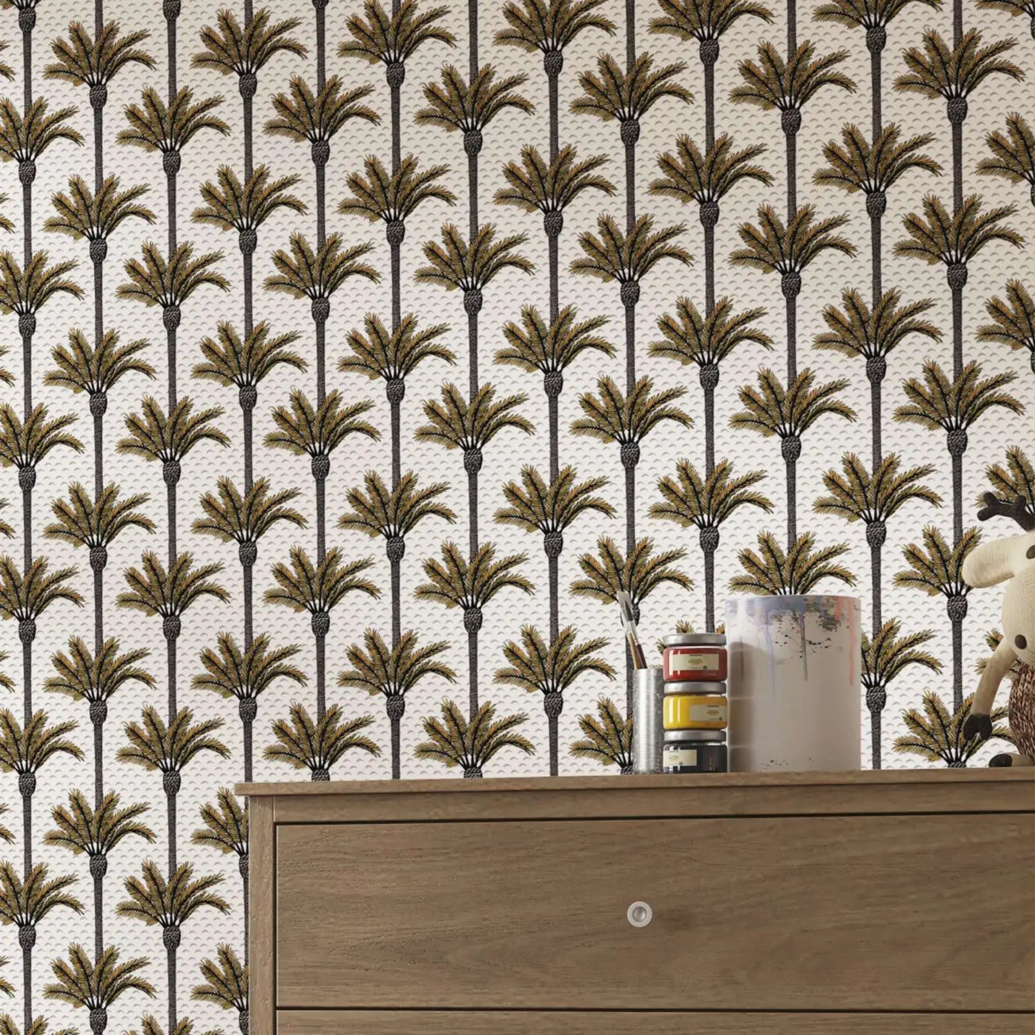 Wallpaper with palm tree pattern and a wooden dresser in the foreground.